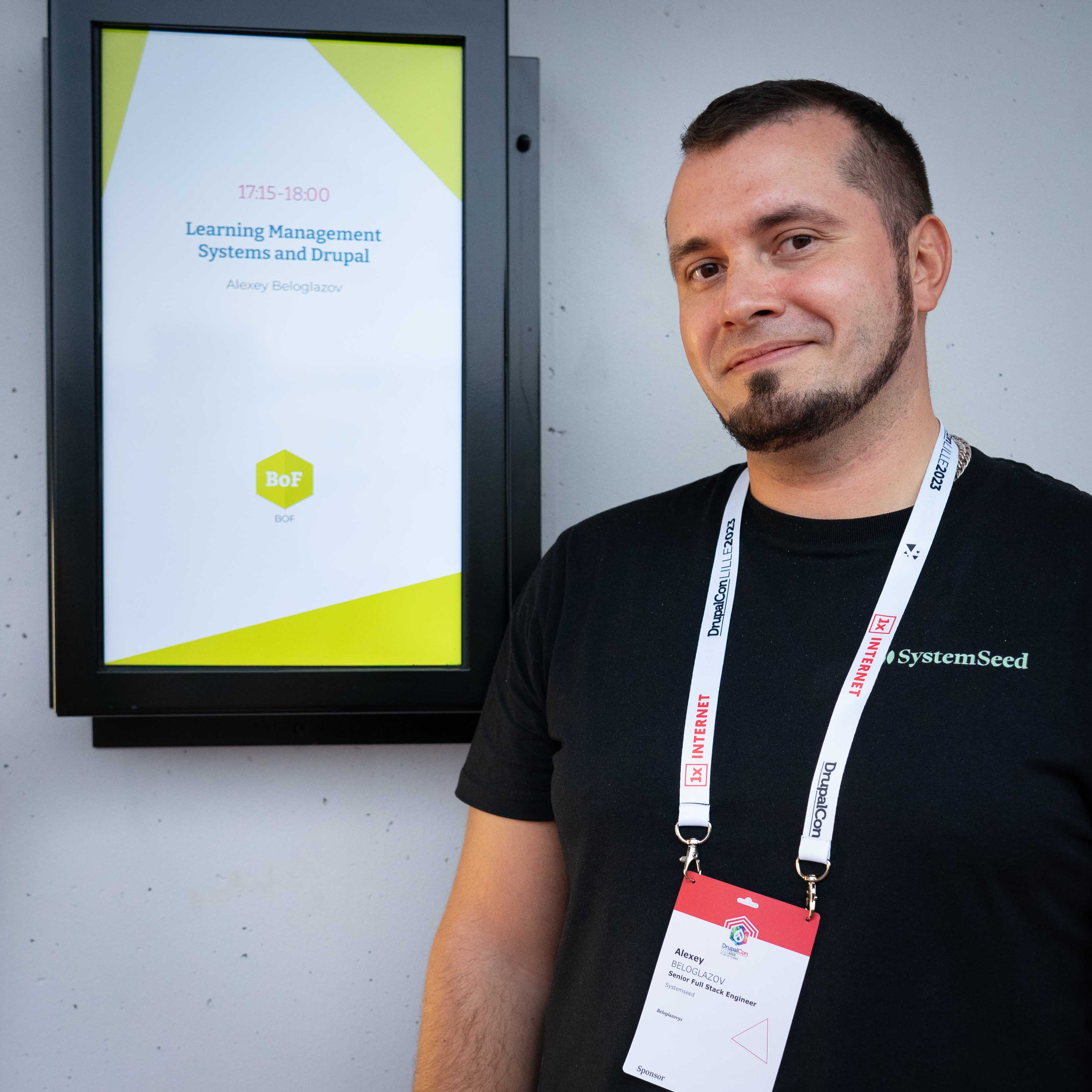 White man in front of the entrance of room of conference