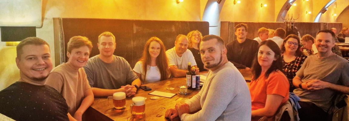 The SystemSeed team has lunch in Prague SystemSeed team members all sitting around a table together