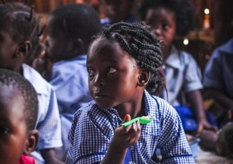 Child eating lunch at a Concern-supported school
