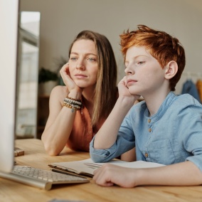 Two people learning at a computer